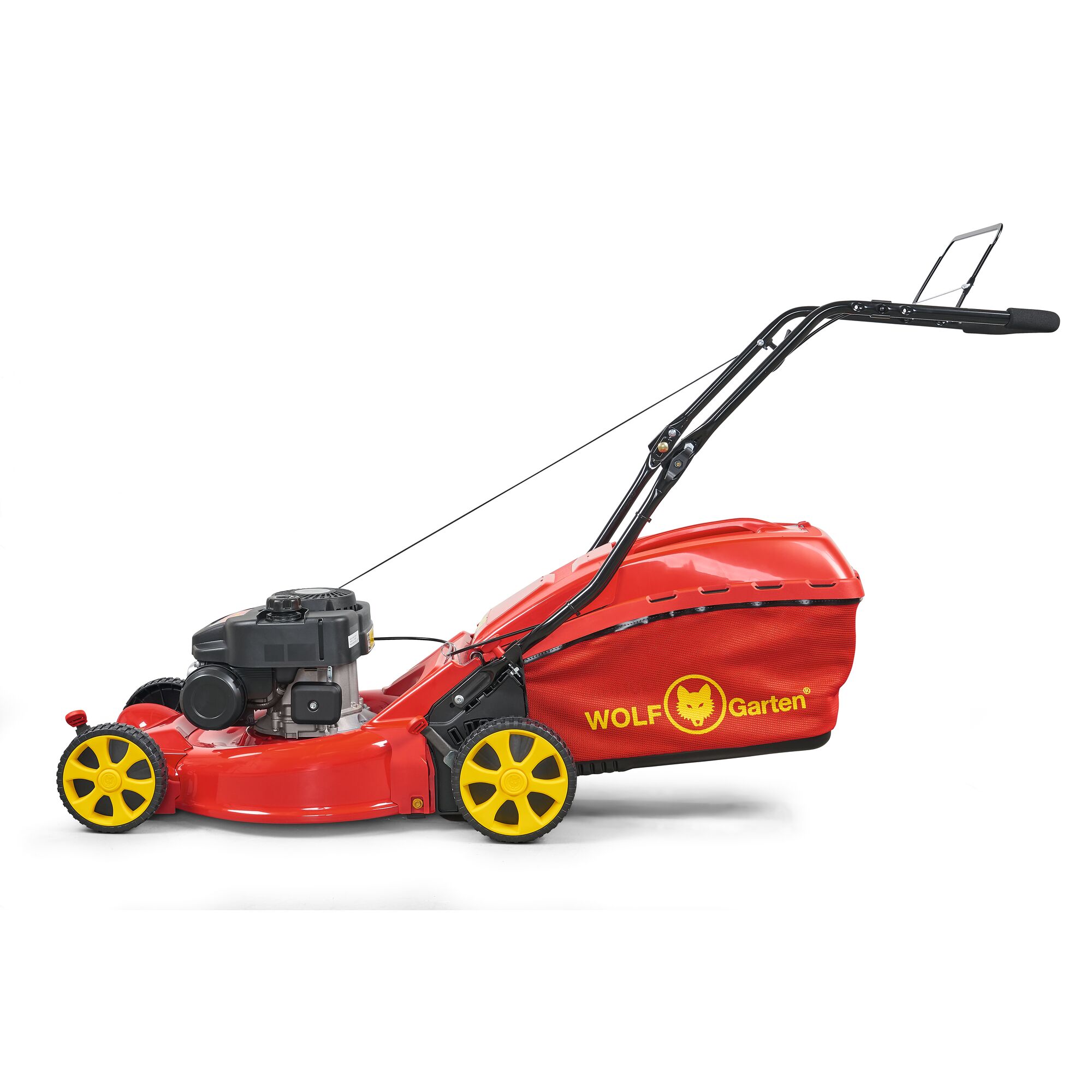 A red and yellow WOLF Garten lawn mower with a grass collection bag, seen from the side.