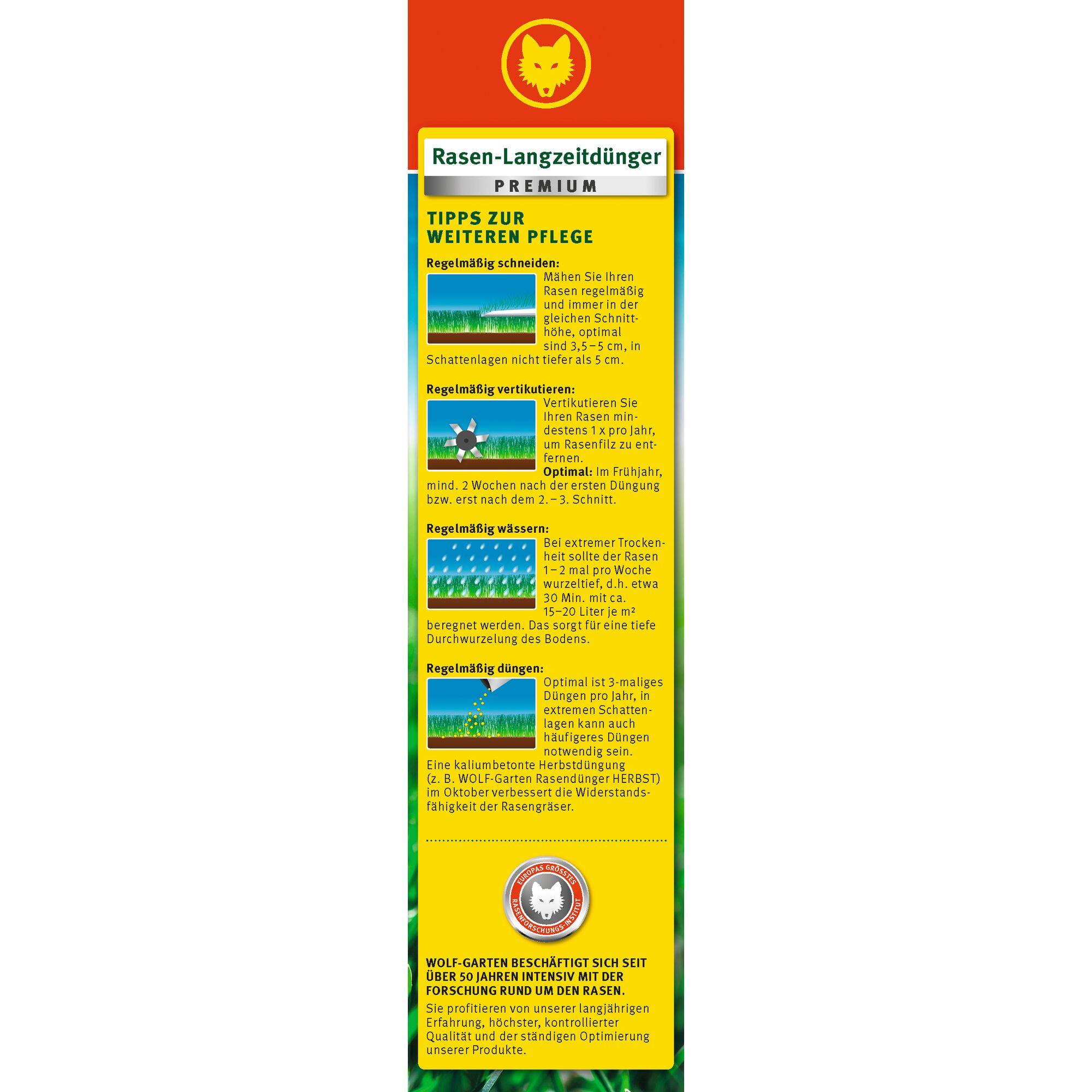 Vertical product label for WOLF-Garten Rasen-Langzeitdünger Premium lawn fertilizer. The label features the WOLF-Garten logo at the top, followed by recommendations for lawn maintenance including mowing, aerating, watering, and fertilizing, with small illustrative images beside each tip. Instructions are written in German. The bottom section highlights the company’s 50 years of research in lawn care.