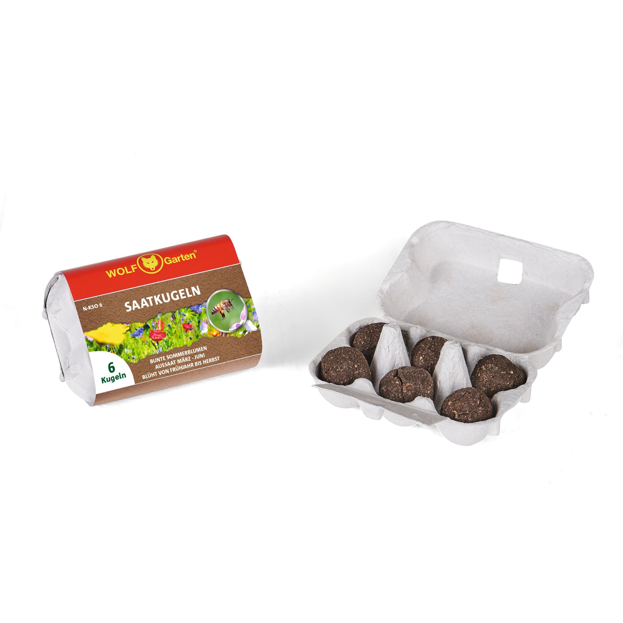 A package of WOLF Garten seed balls with six brown seed balls in an open egg carton. The packaging features colorful flowers and information about the product.