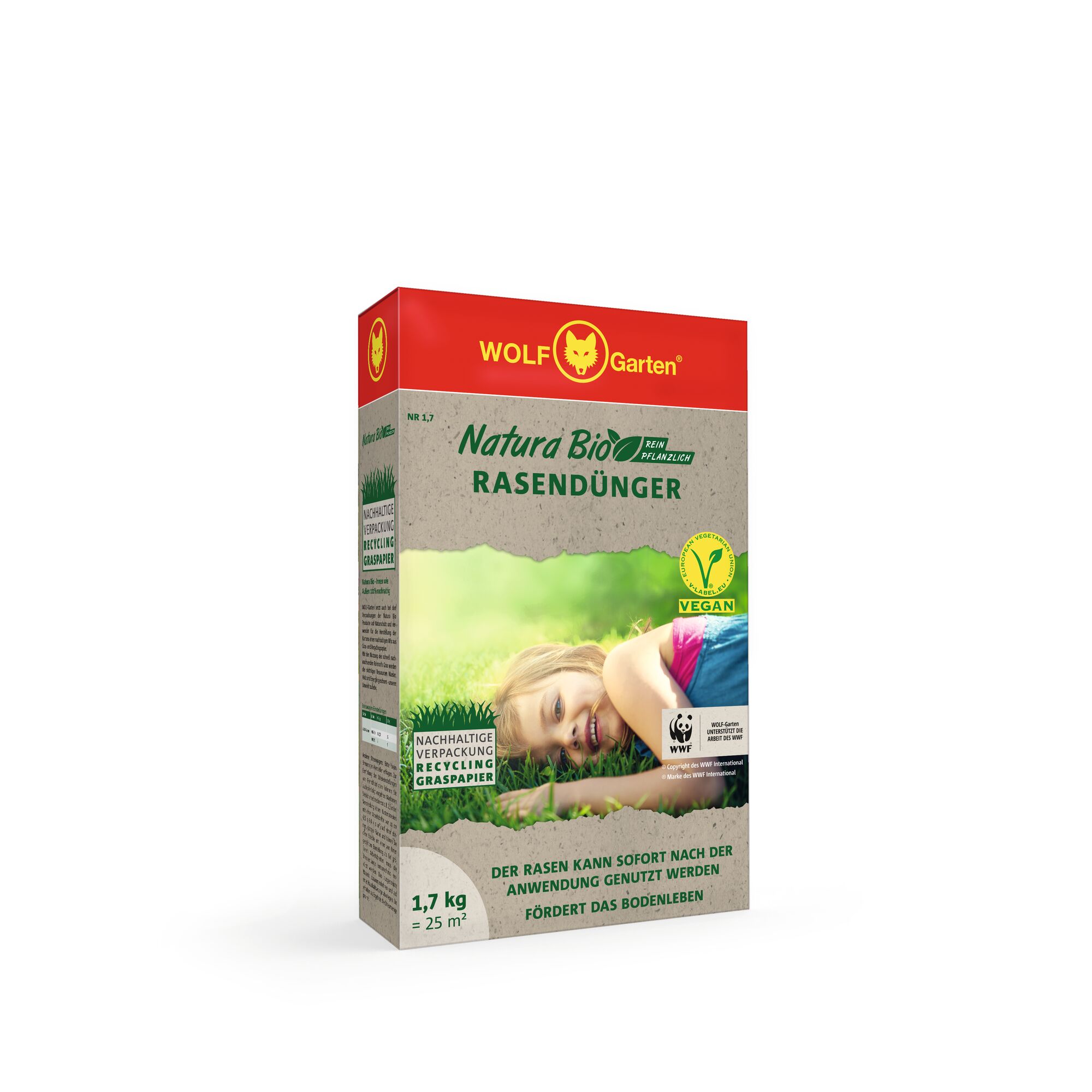 Front view of a WOLF-Garten Natura Bio Rasendünger (lawn fertilizer) box. The packaging has a red top with the WOLF-Garten logo, and the main box is grey and green with text and images of a family laying on green grass. The box mentions it is vegan, made from plant-based ingredients, has sustainable packaging from recycled grass paper, weighs 1.7 kg, and covers 25 square meters.