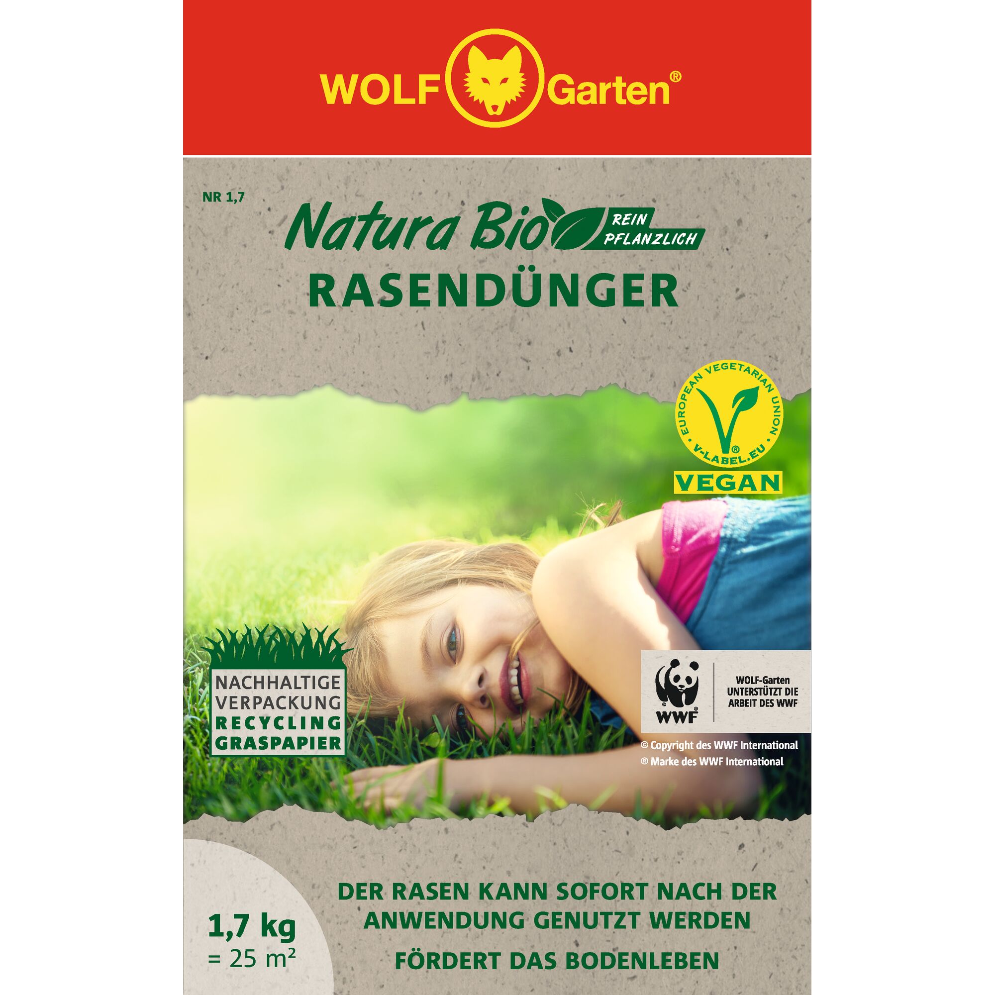 Front packaging of WOLF-Garten Natura Bio lawn fertilizer featuring sustainability and vegan certifications, made with recycled grass paper. The package shows a person lying on grass and mentions support from WWF. Contains 1.7 kg for 25 square meters.