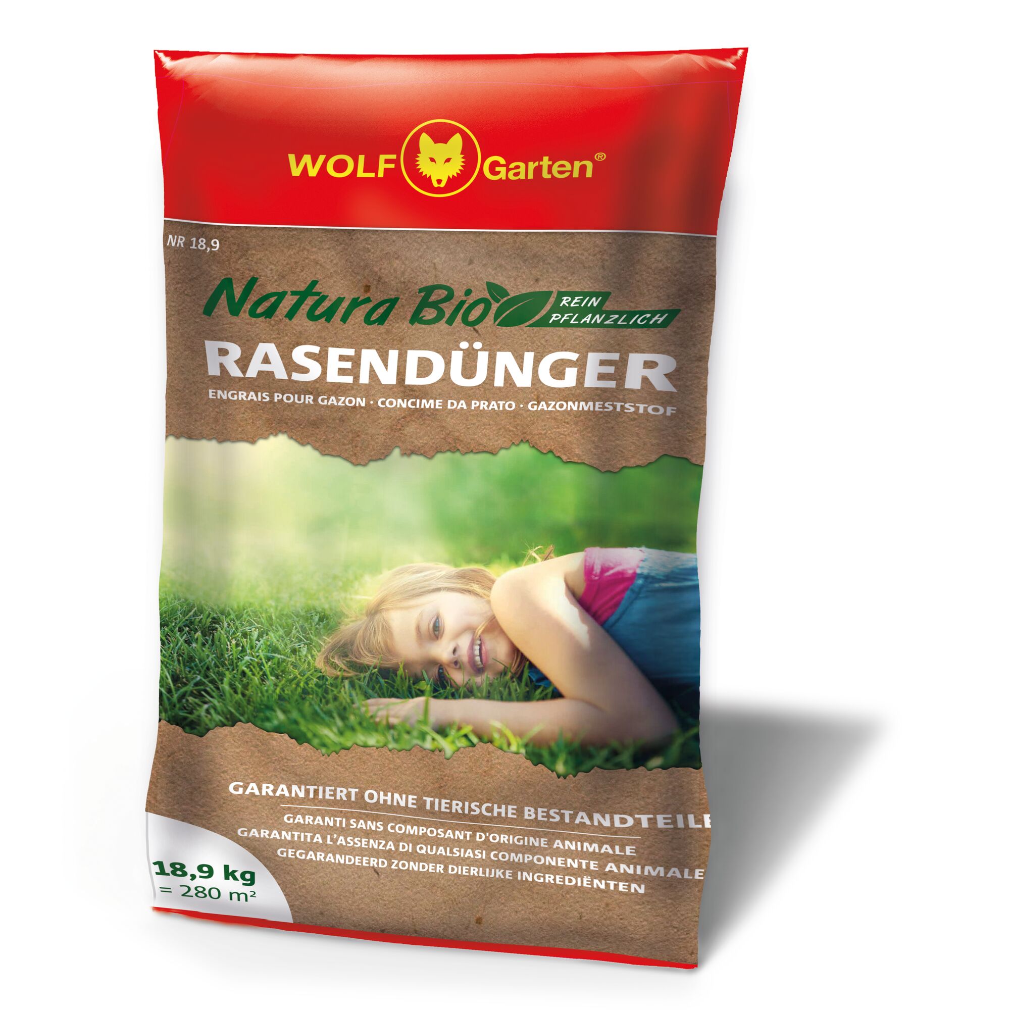 A bag of WOLF-Garten Natura Bio pure plant lawn fertilizer, featuring a red and brown packaging with product information and an image showing a person lying on grass. The packaging highlights that the fertilizer contains no animal ingredients, is suitable for 280 m², and weighs 18.9 kg.