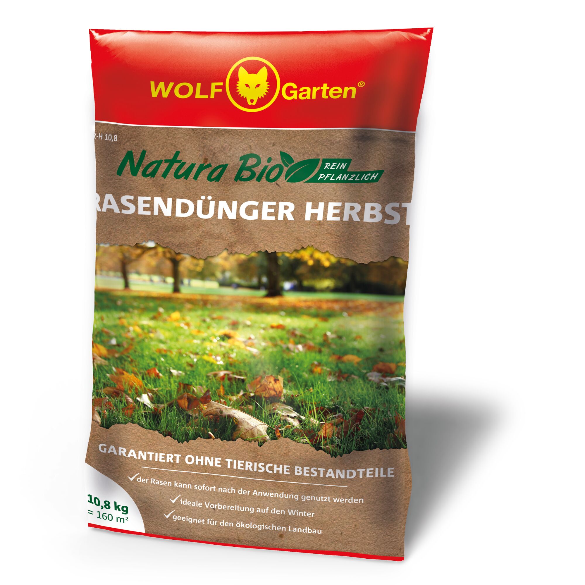 A bag of WOLF Garten Natura Bio pure plant-based autumn lawn fertilizer. The packaging is red and brown, with a picture of a grassy lawn with autumn leaves. The text highlights that the product is guaranteed without animal ingredients and suitable for organic farming.
