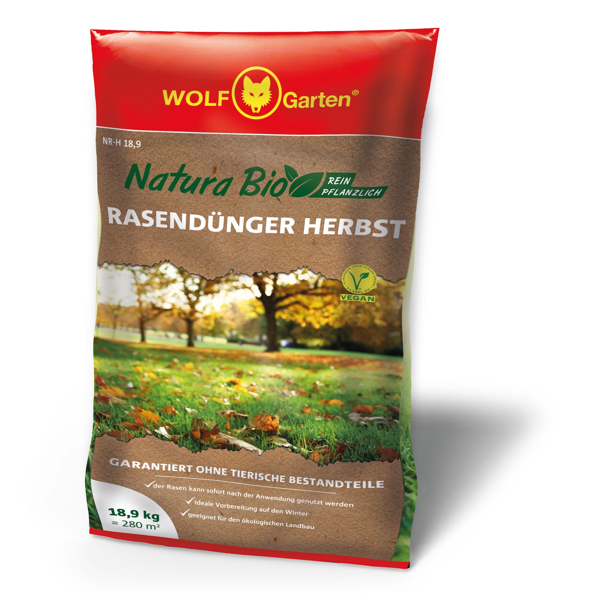 A bag of WOLF-Garten Natura Bio Autumn Lawn Fertilizer. The packaging is red and brown, showing a picture of a park with trees and grass covered with autumn leaves. The text highlights that it is vegan, purely plant-based, suitable for organic farming, and weighs 18.9 kg for 280 square meters.