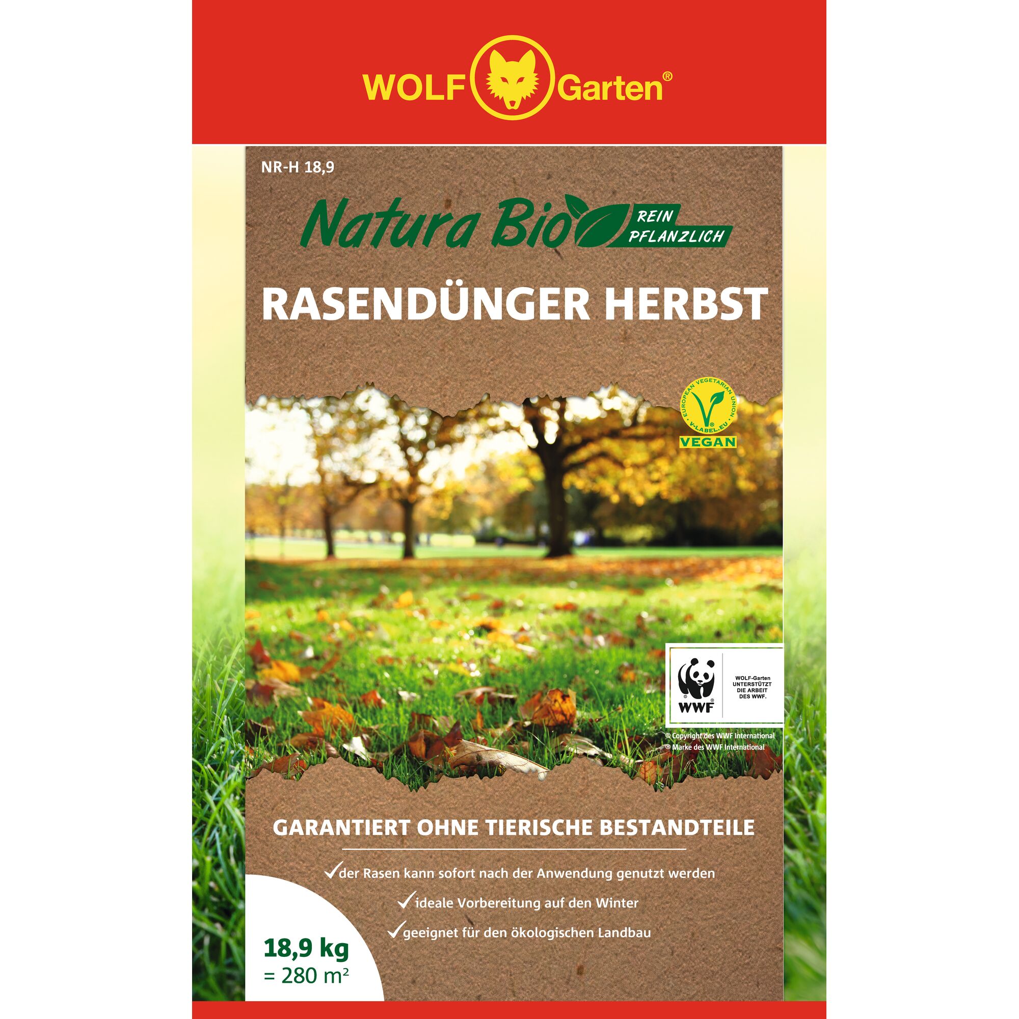 Front view of a WOLF Garten Natura Bio autumn lawn fertilizer package. The packaging features the WOLF Garten logo on a red background, text indicating it is purely plant-based, vegan, and suitable for organic farming. The image shows a grassy lawn with autumn leaves and trees in the background. Information includes a weight of 18.9 kg covering 280 square meters, with guarantees of no animal ingredients and WWF support.