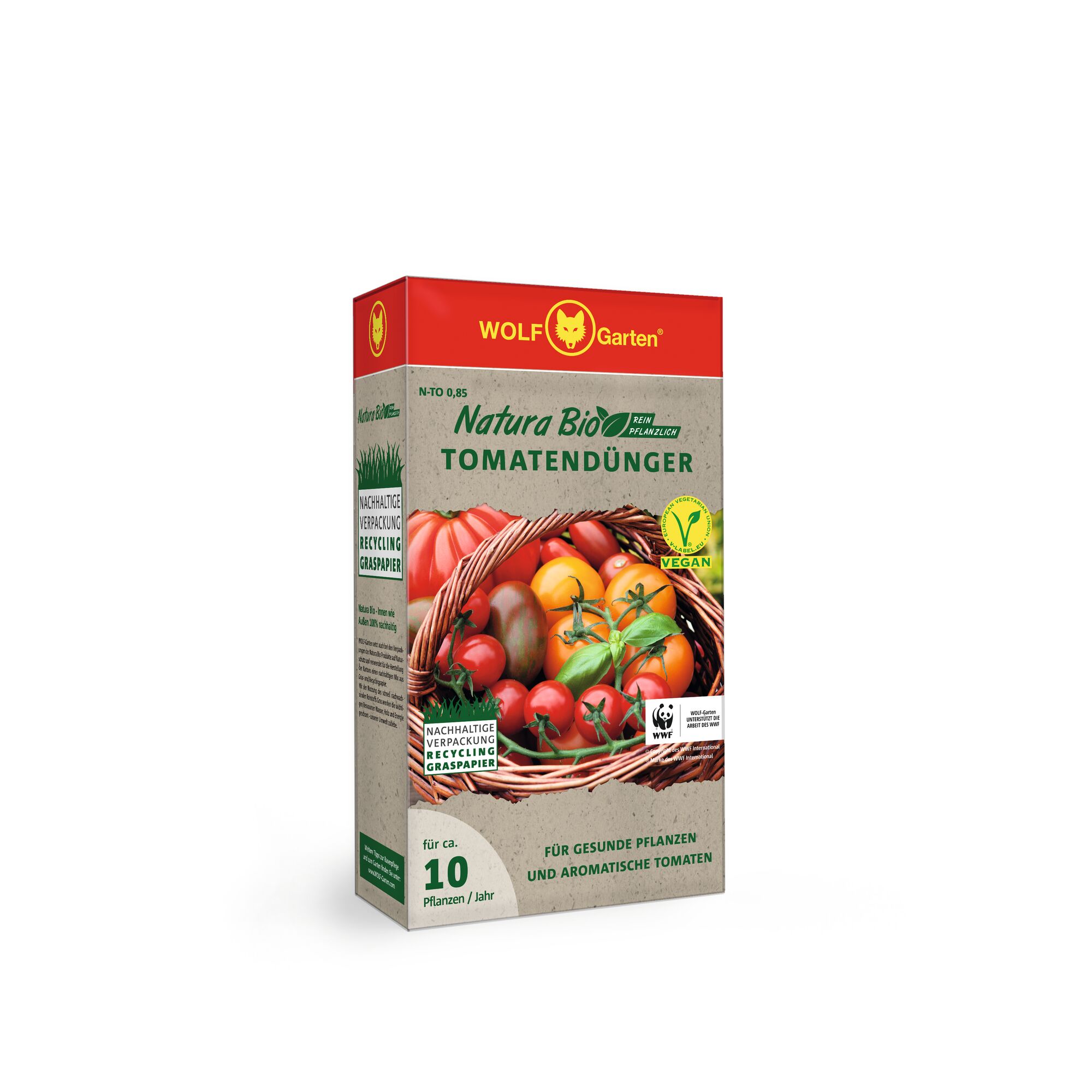 A box of WOLF-Garten Natura Bio vegan tomato fertilizer, featuring sustainable packaging made from recycled grass paper. The front of the box shows a basket of fresh tomatoes and promotes healthy plants and aromatic tomatoes for around 10 plants per year.