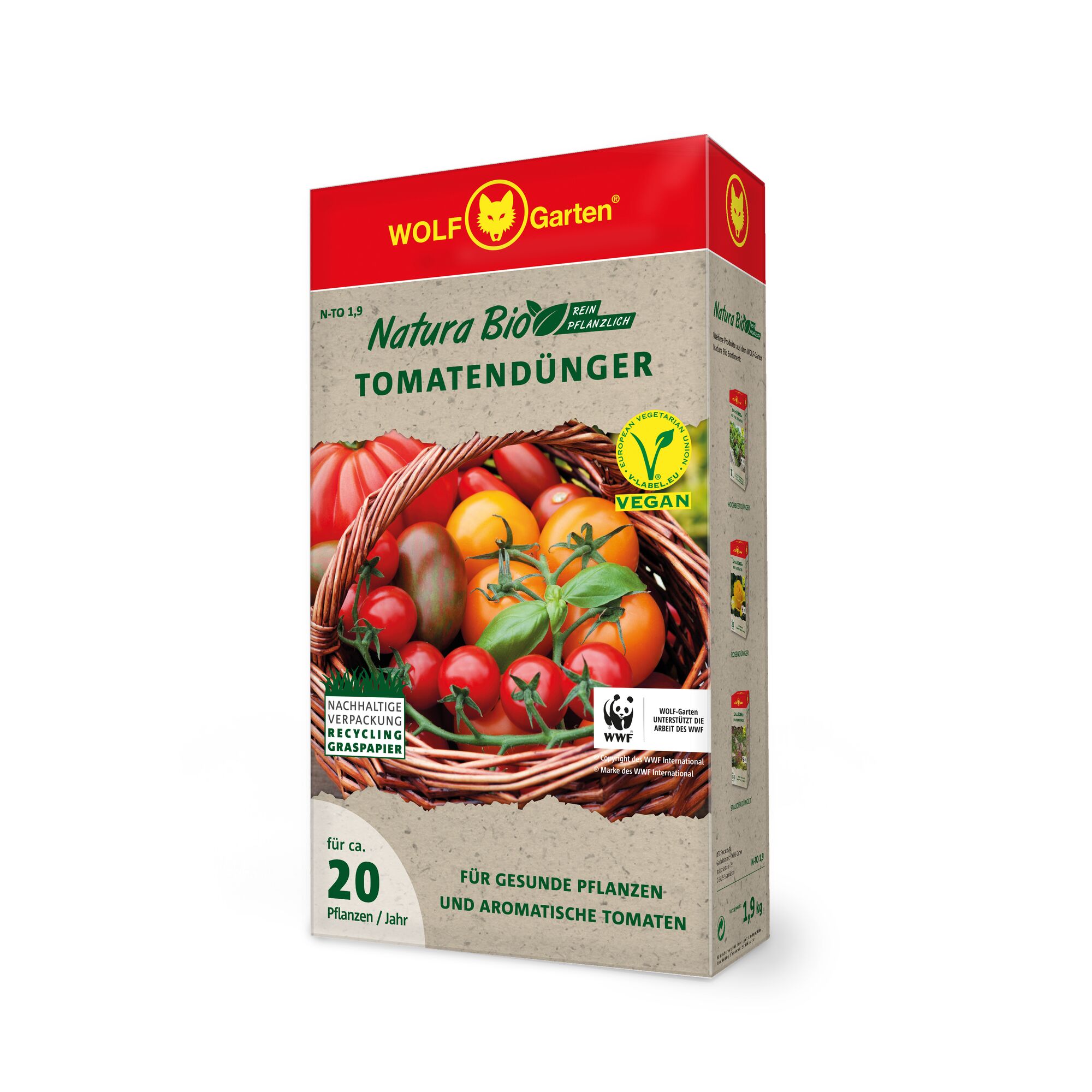 A box of WOLF-Garten Natura Bio tomato fertilizer with vegan certification. The packaging features a basket of assorted tomatoes and various eco-friendly labels, including sustainable packaging and recycling logos. The box is designed for approximately 20 plants per year and promotes healthy, aromatic tomatoes.