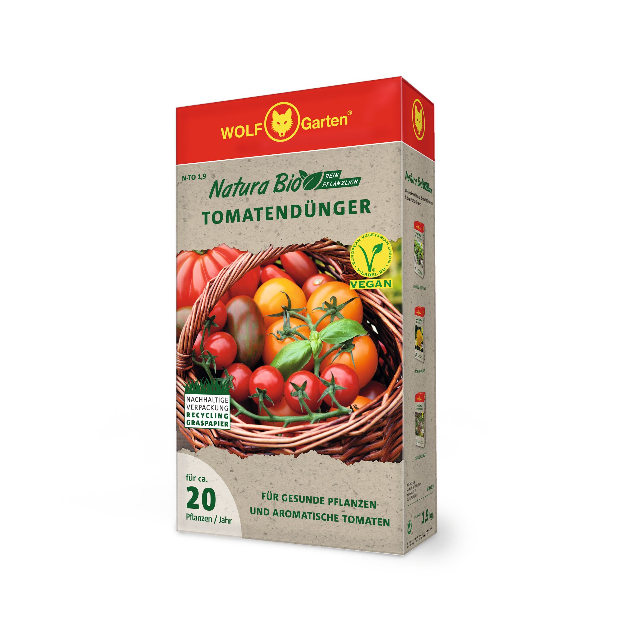 Rectangular box of WOLF-Garten Natura Bio tomato fertilizer, featuring a basket of assorted tomatoes on the front. The packaging highlights that the product is vegan and made from plant-based ingredients, with sustainable recycling paper. Text indicates it is suitable for approximately 20 plants per year.
