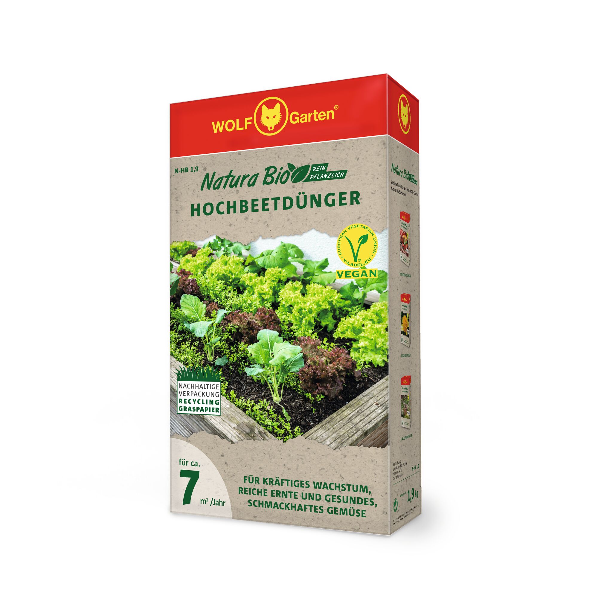 A box of WOLFGarten Natura Bio vegan raised bed fertilizer, featuring a photo of leafy vegetables growing in a raised garden bed on the packaging. The box highlights sustainable packaging made from recycled grass paper and indicates use for approximately 7 square meters per year.