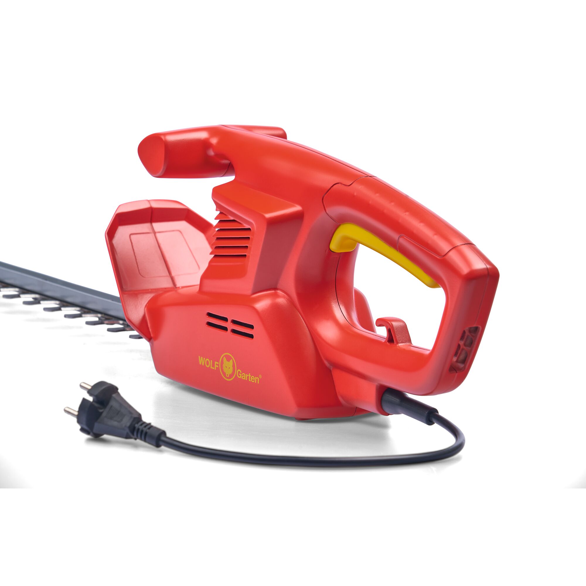 A red electric hedge trimmer with a yellow accent on the handle. The trimmer is branded WOLFGarten and features a power cord with a plug.
