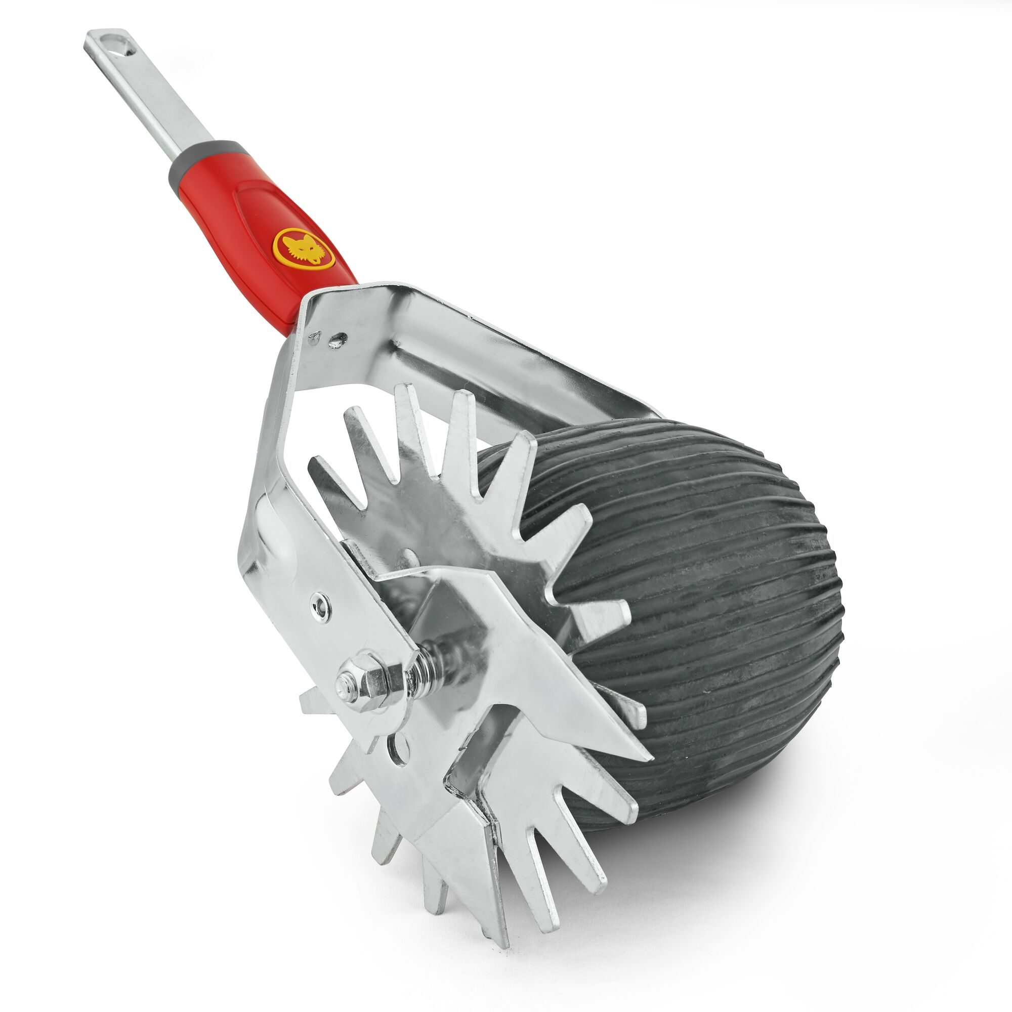 A metal garden tool with a red handle, featuring spiked wheels and a ribbed roller. The tool is used for lawn care and soil preparation.