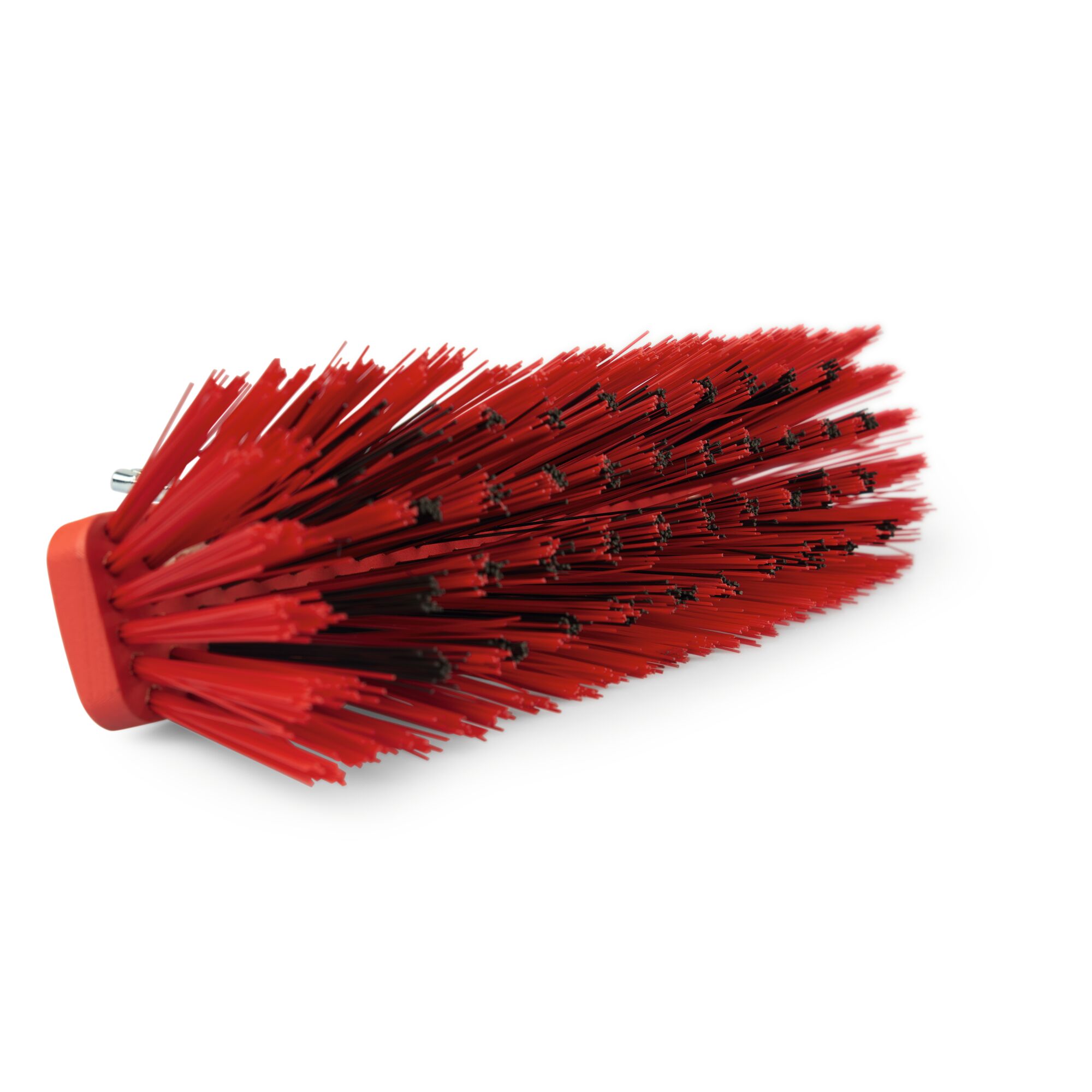 Close-up of a red angled brush head with stiff synthetic bristles, photographed against a white background.