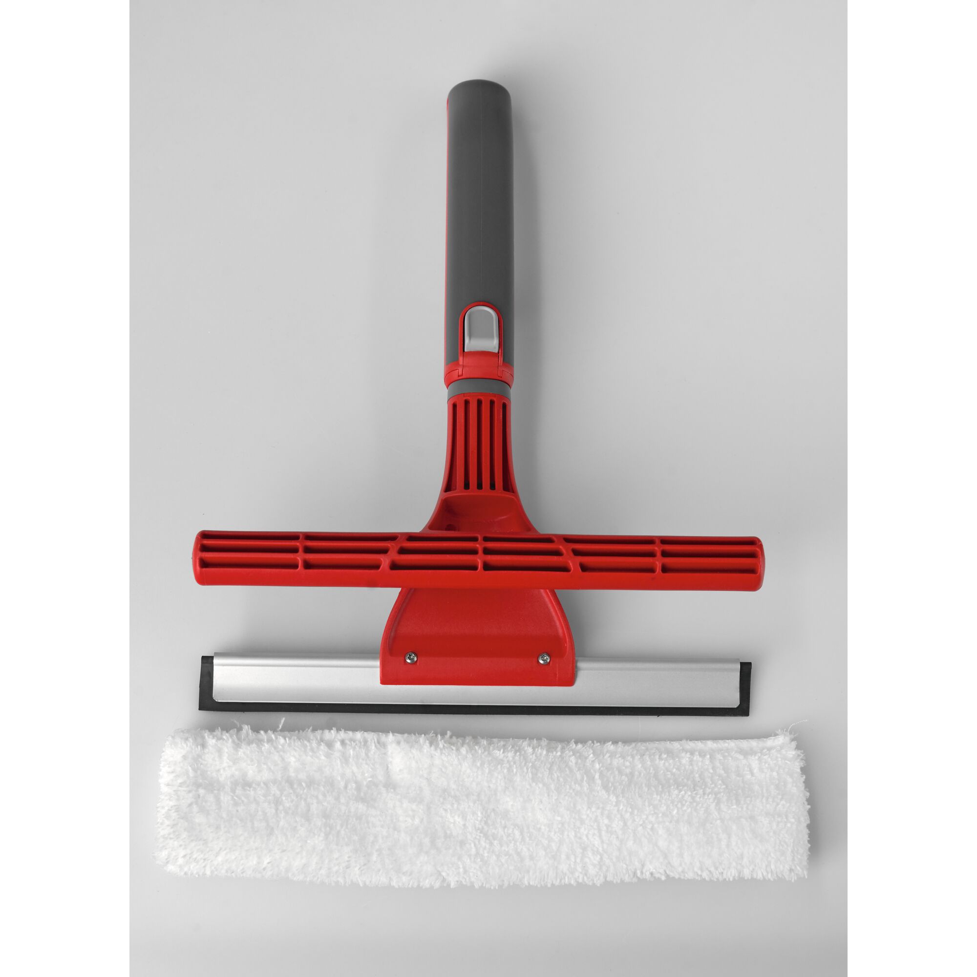 A red and grey window cleaning tool with a squeegee and a detachable white microfiber cloth.