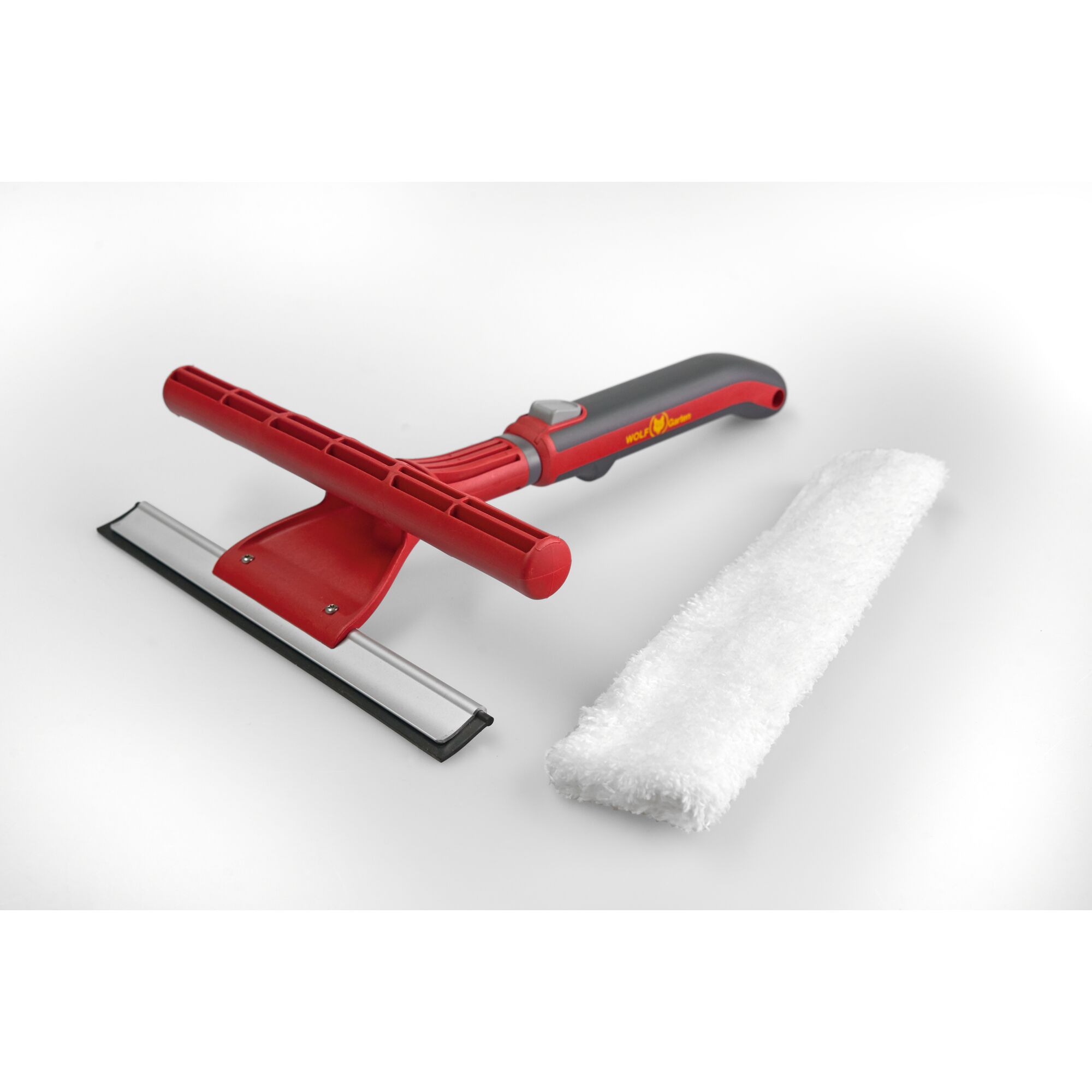 Red and grey window squeegee with a handle and a removable white microfiber cleaning pad, designed for cleaning glass surfaces.