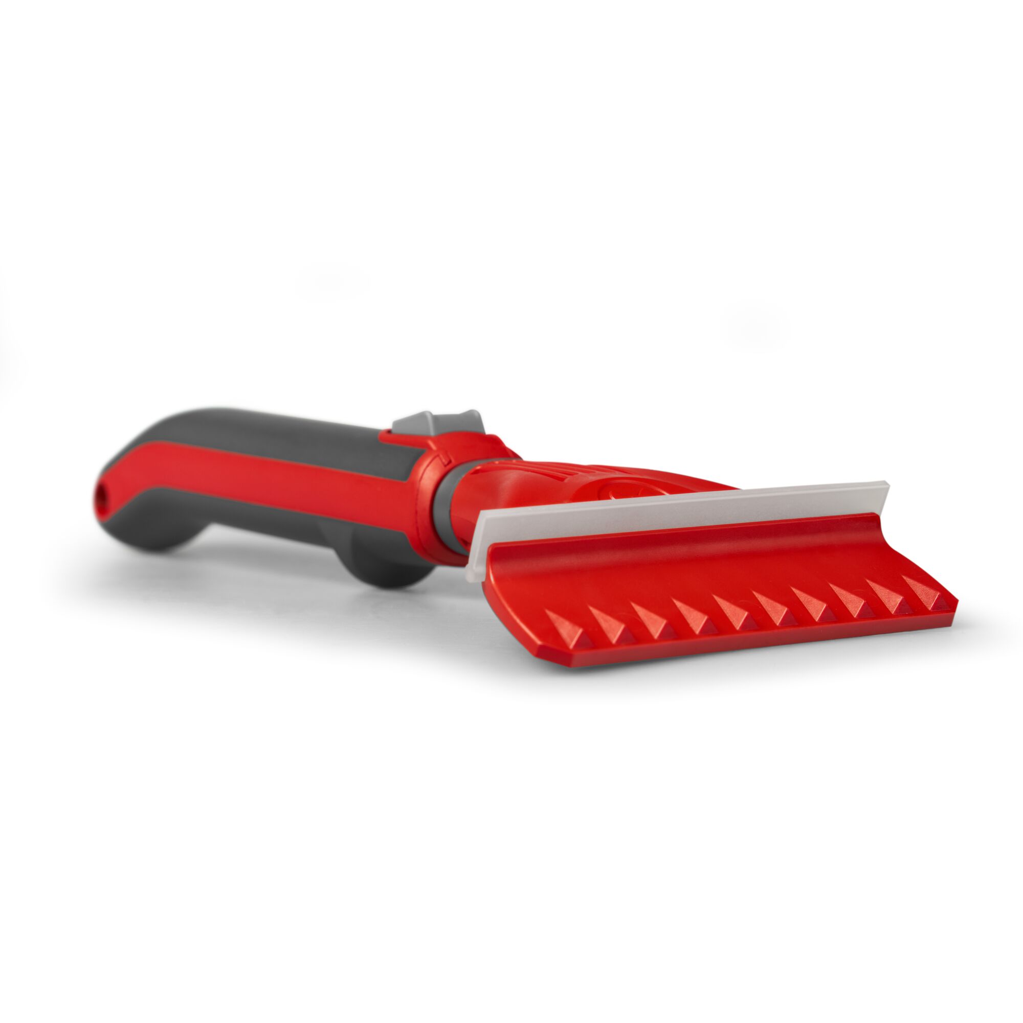 A close-up image of a red and black gardening tool with a textured blade and ergonomic handle, designed for scraping or cleaning tasks.