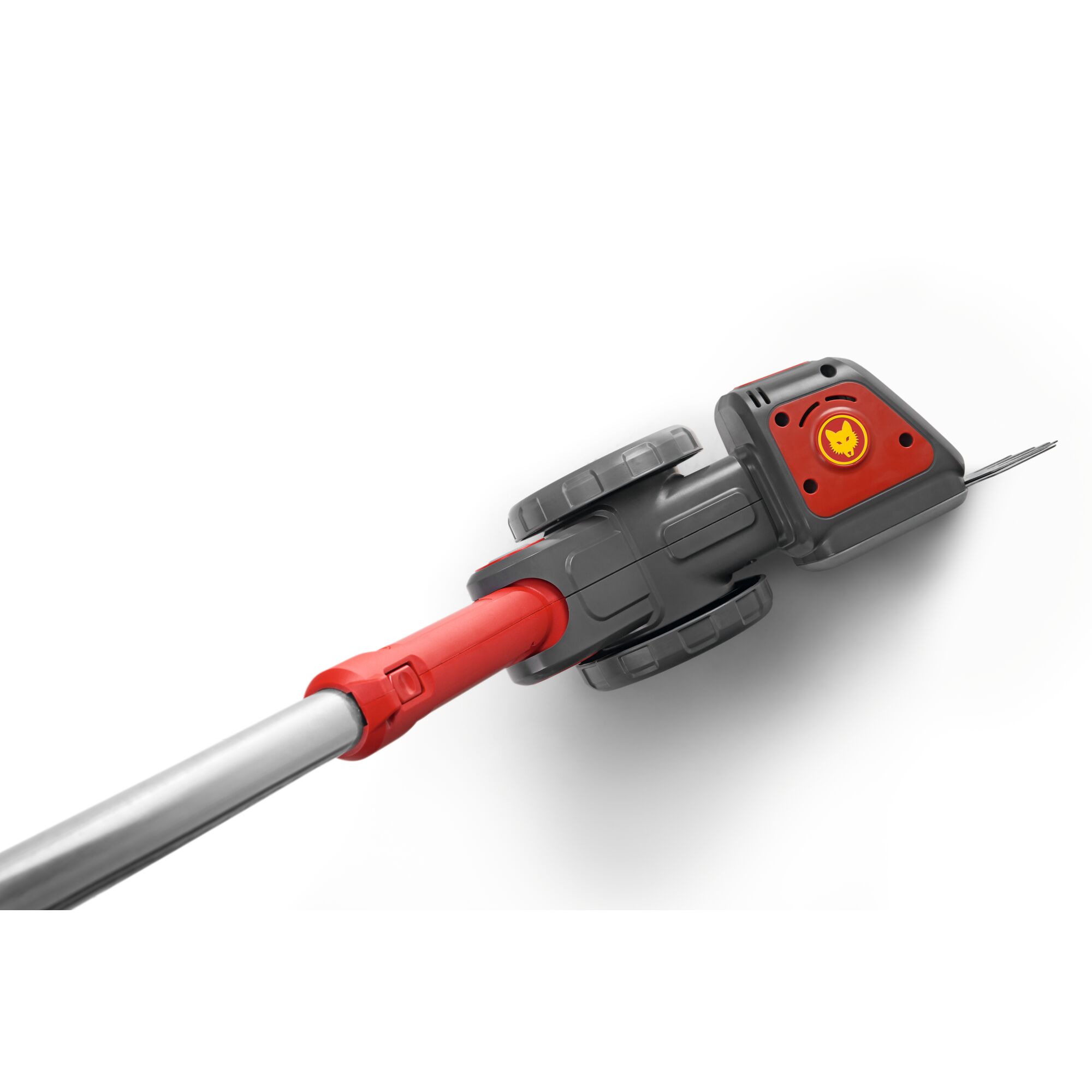 Close-up of a WOLFGarten garden tool with grey wheels and a red handle, featuring the brand's yellow logo on a red panel.