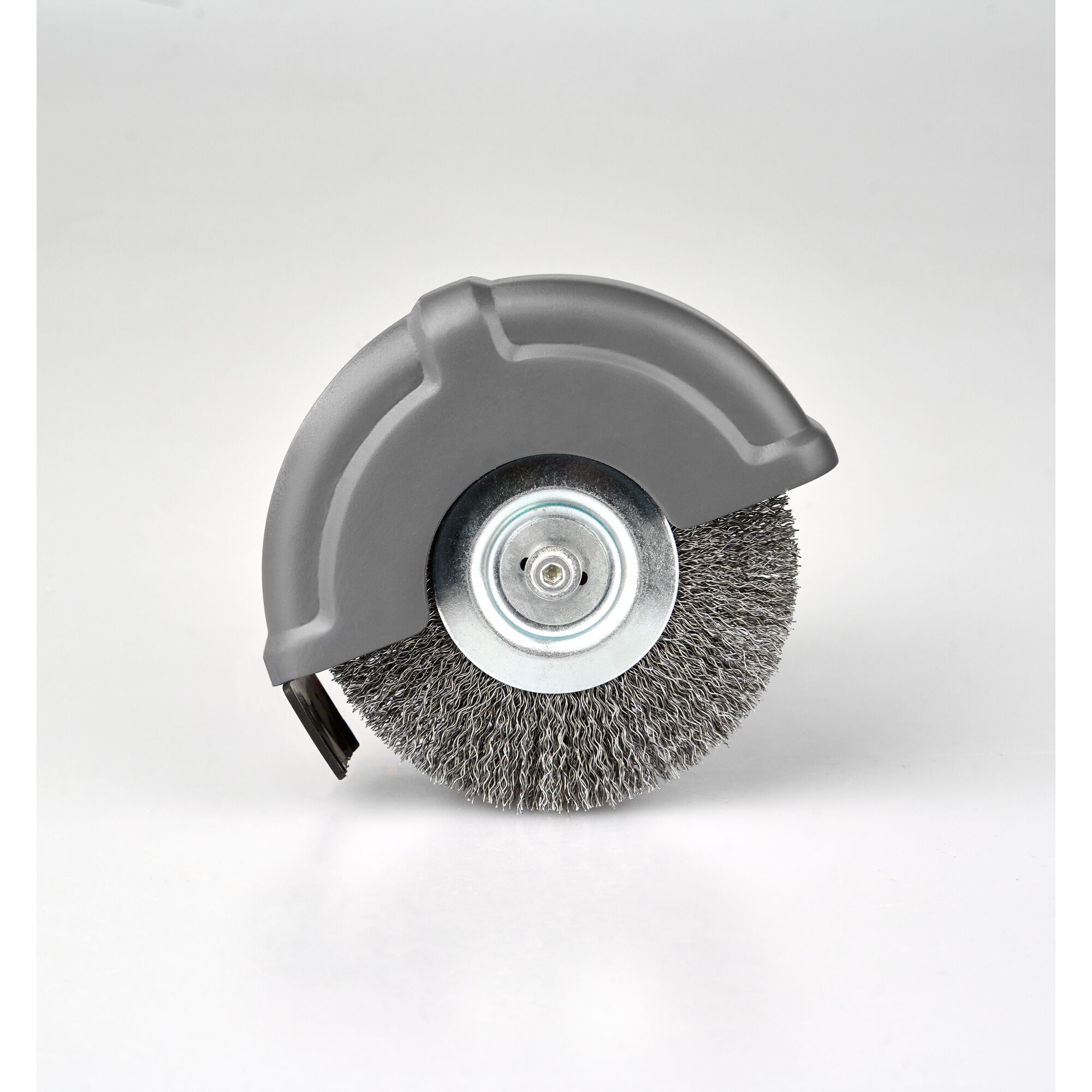 A close-up image of a wire brush wheel with a grey protective cover, commonly used for cleaning or polishing surfaces.