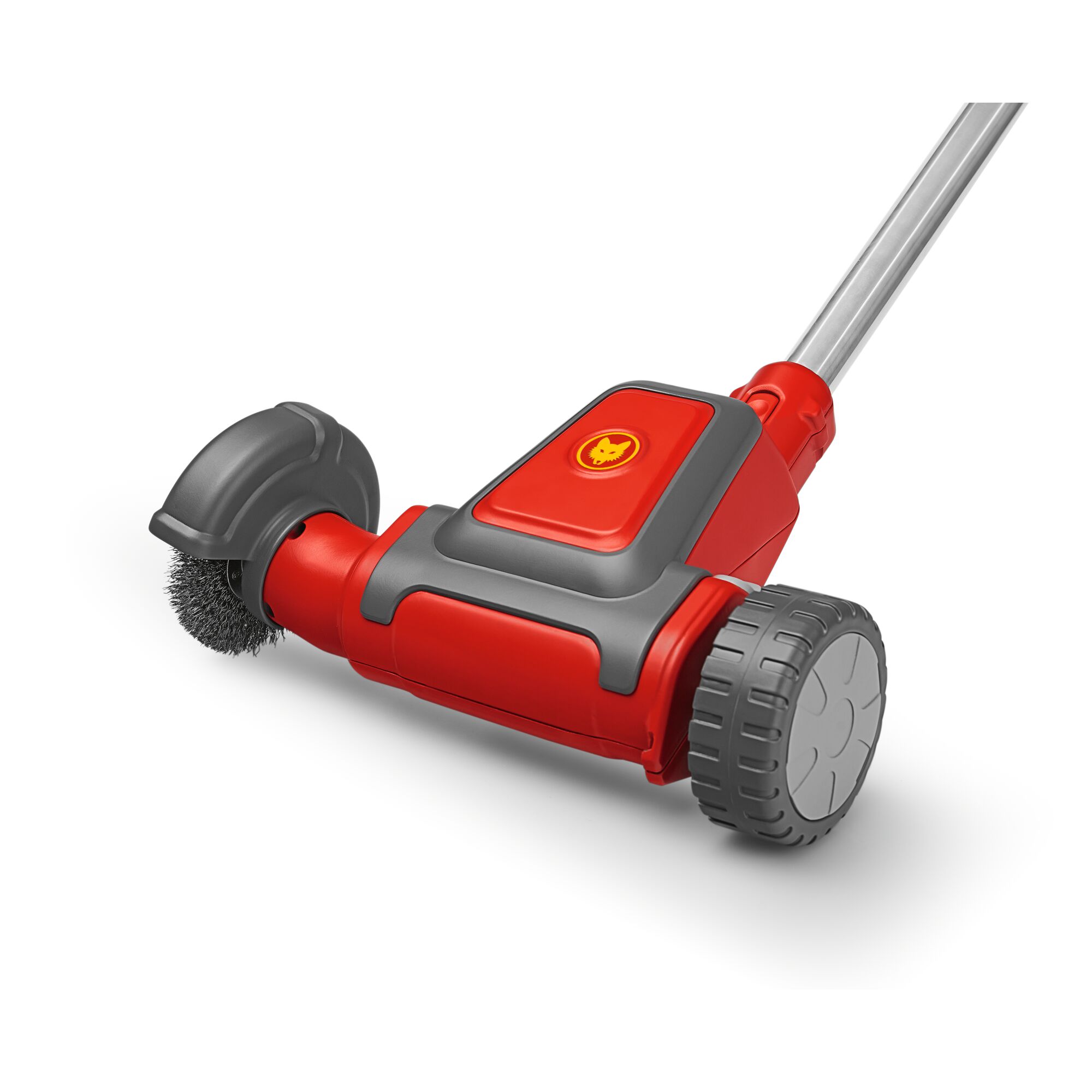 A close-up of a red and grey WOLFGarten garden tool, showing a wire brush attachment and wheels. The product is used for cleaning outdoor surfaces such as patios and driveways.