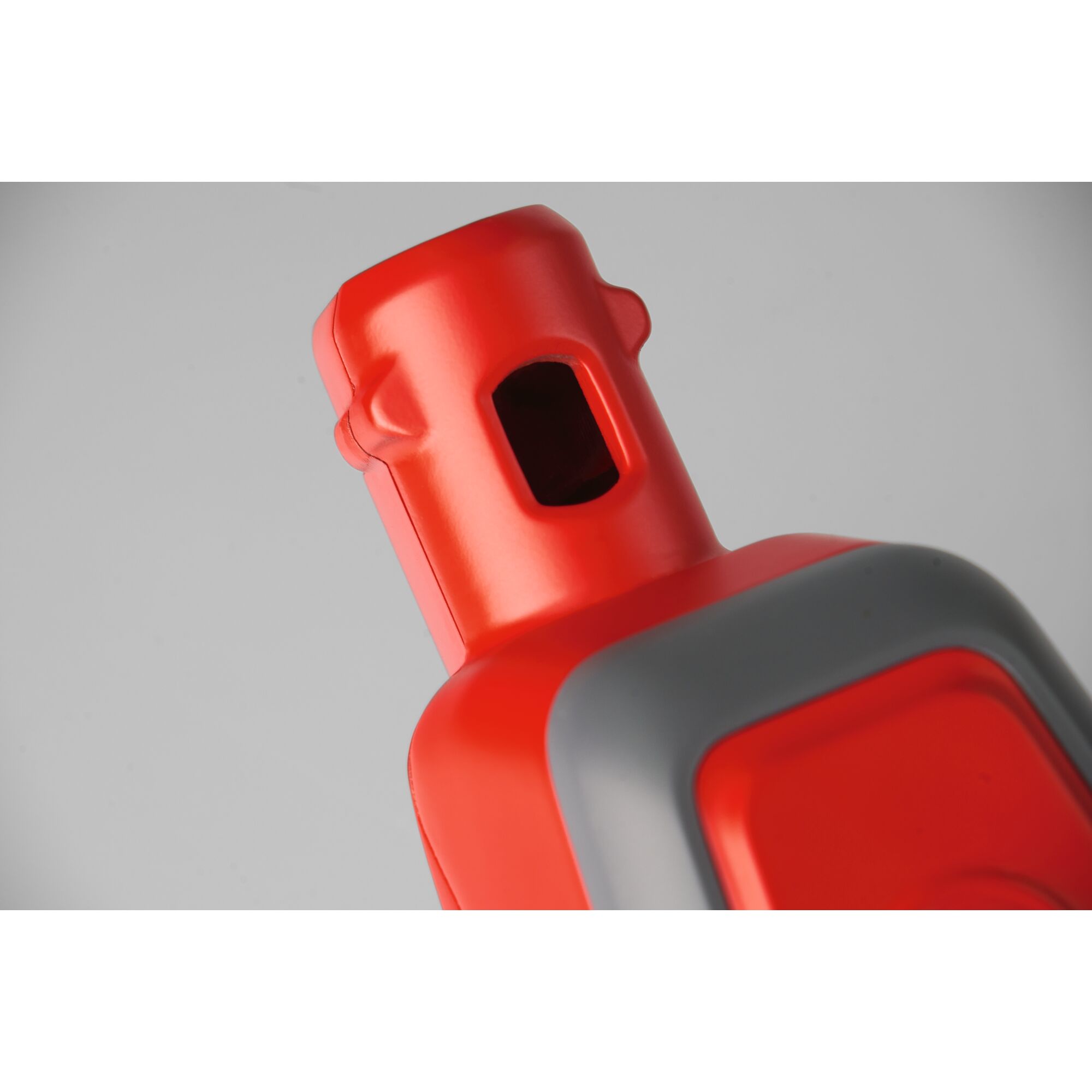 Close-up image of a red and grey plastic component, likely part of a gardening tool or equipment.