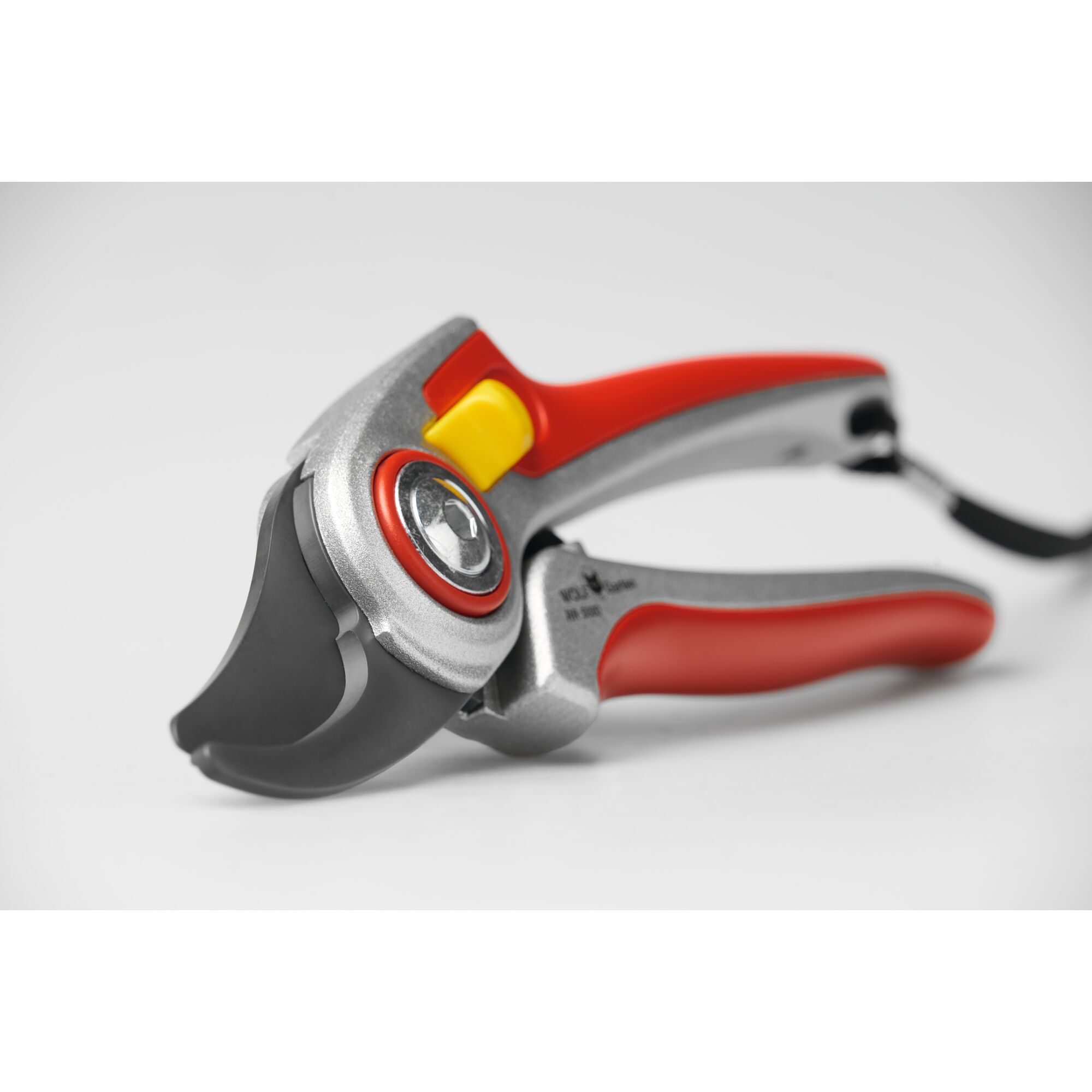 Close-up of a WOLF-Garten hand pruner with a red and silver handle and a black cutting blade, designed for gardening and plant trimming, shown against a white background.
