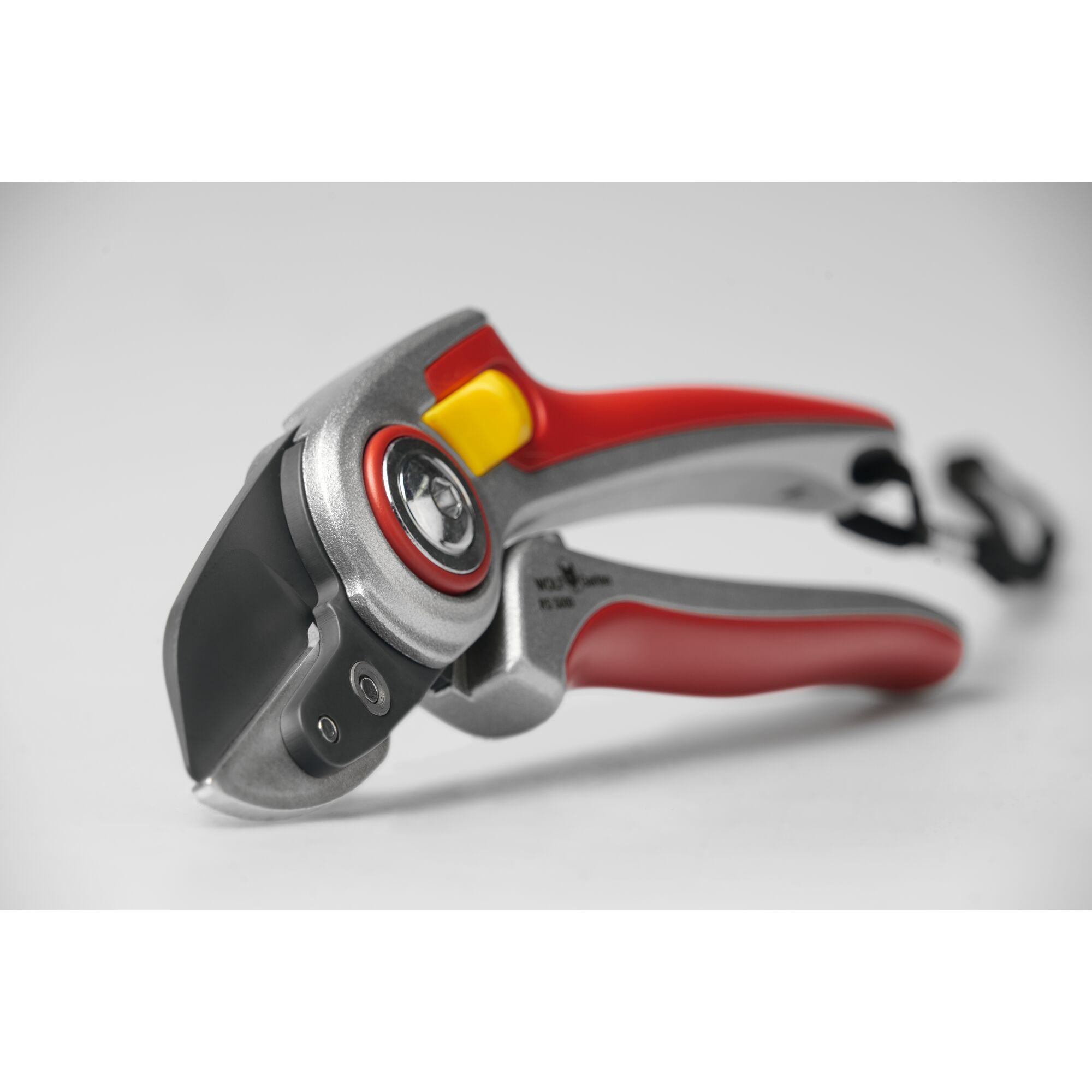 Close-up of a garden pruner with a sharp black blade, ergonomic red and silver handle, and a yellow safety lock, placed on a neutral background.