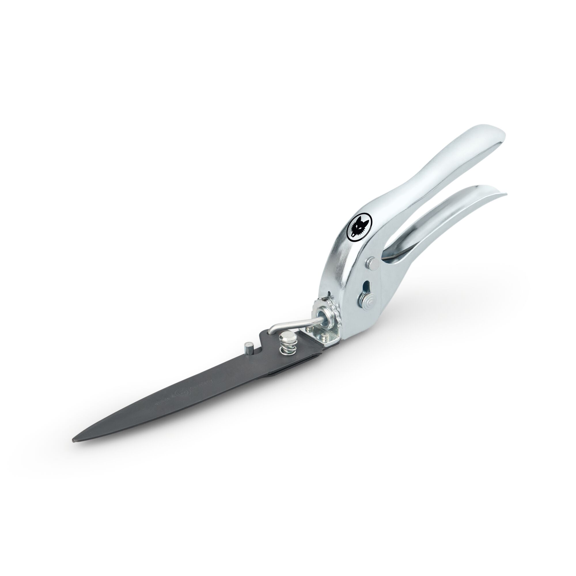 A metal grass shear with a silver handle and black blades, designed for precise lawn and garden trimming. The tool features a spring mechanism and a locking device, with the WOLFGarten logo visible on the handle.