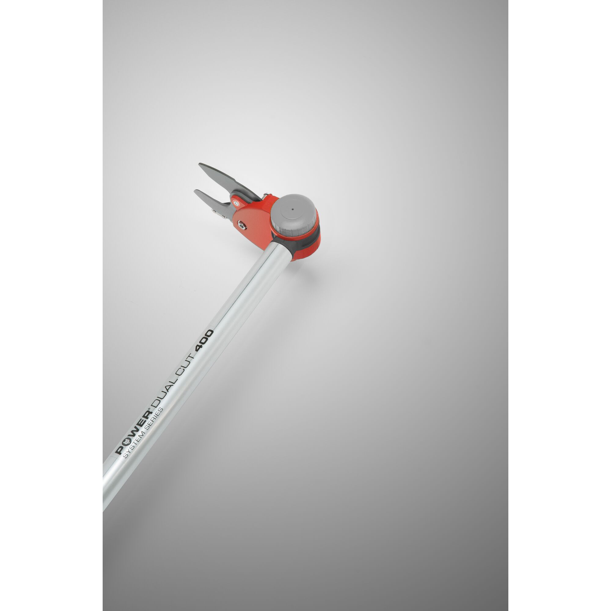 A close-up view of a WOLFGarten Power Dual Cut 400 garden lopper with a silver handle and red cutting mechanism, displayed against a neutral gray background.