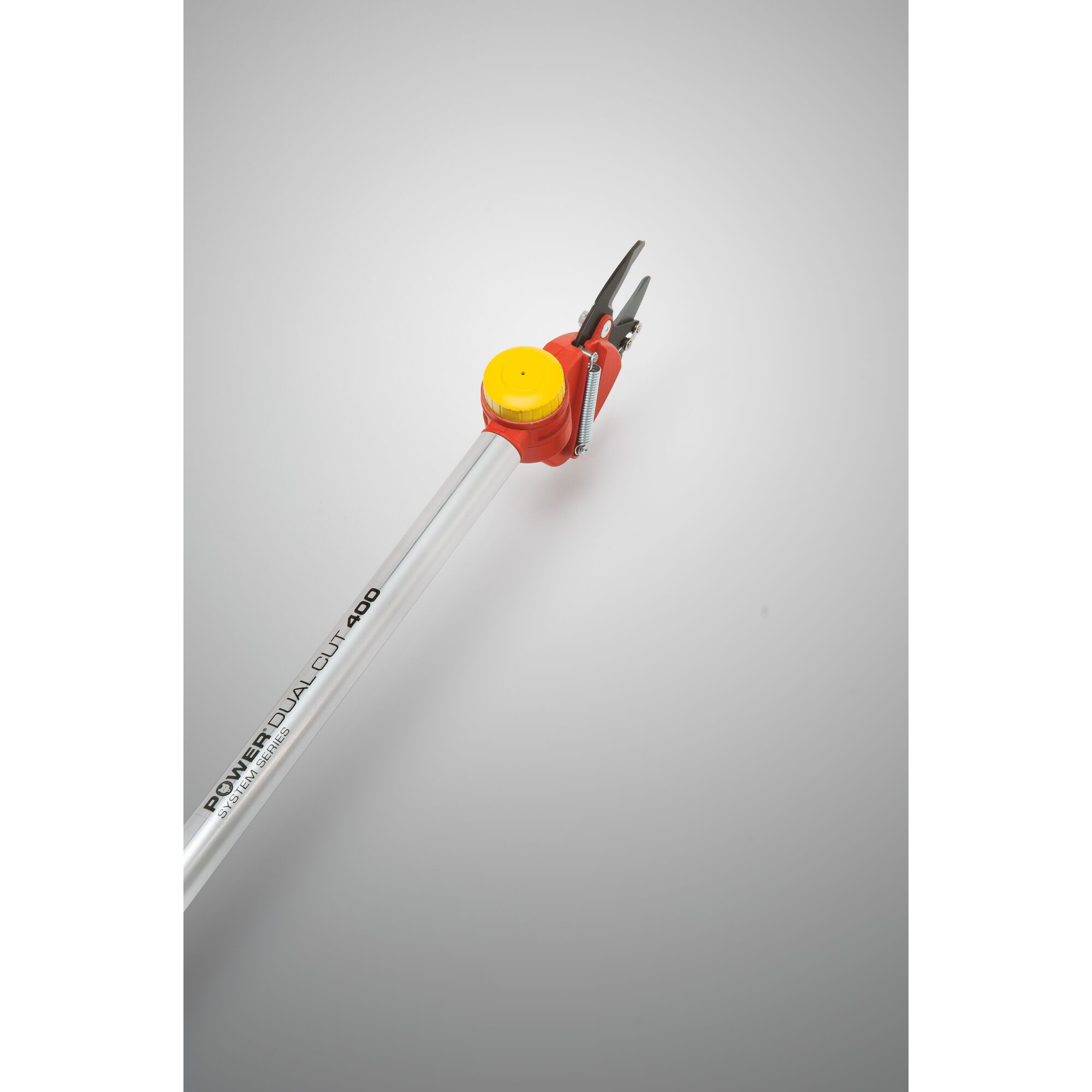 A pruning tool with a long silver handle featuring the text 'POWER DUAL CUT 400,' a red attachment, and a yellow knob at the top near the black cutting blades, photographed against a neutral background.