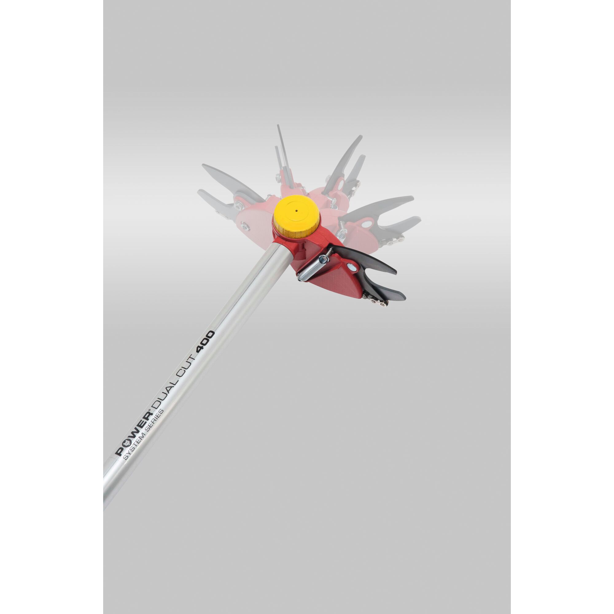 A WOLF-Garten Power Dual Cut 400 telescopic pruning tool with a red and yellow adjustable cutting head and silver handle, shown against a grey background, demonstrating its rotating head mechanism.