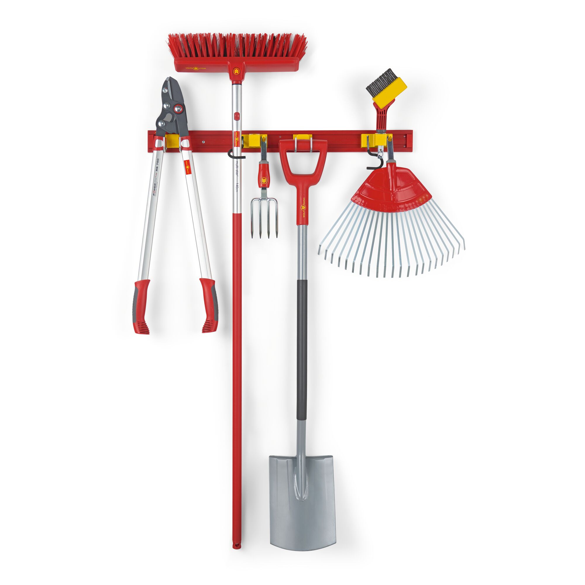 A set of red and silver garden tools, including a broom, lopper, hand fork, shovel, rake, and a small brush, all neatly hanging on a wall-mounted red rack.